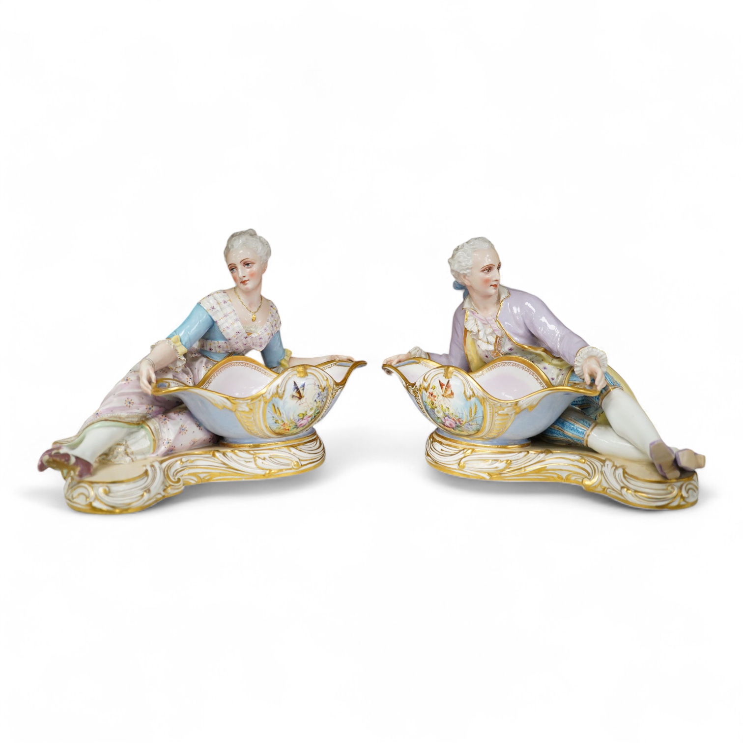 A pair of French porcelain figural sweet meat dishes, late 19th century, 34.5cm